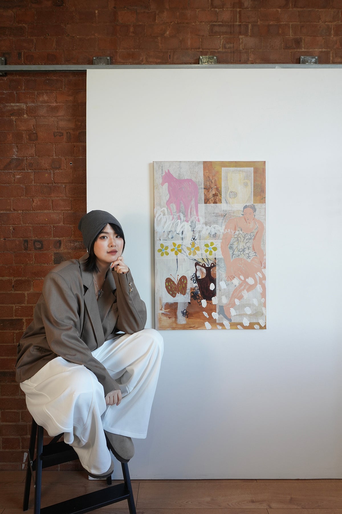 Artwork No Perfect Fit with artist Yusha Zhou, acrylic and mixed media on canvas, bringing together a quiet constellation of symbols: a horse, a butterfly, a vessel, and a seated woman